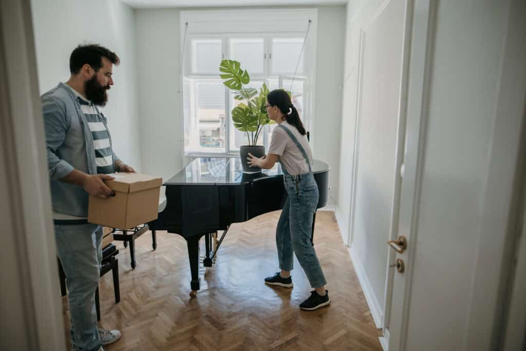 couple moving a piano