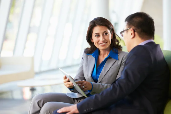 depositphotos 24650795 stock photo businesspeople with digital tablet sitting