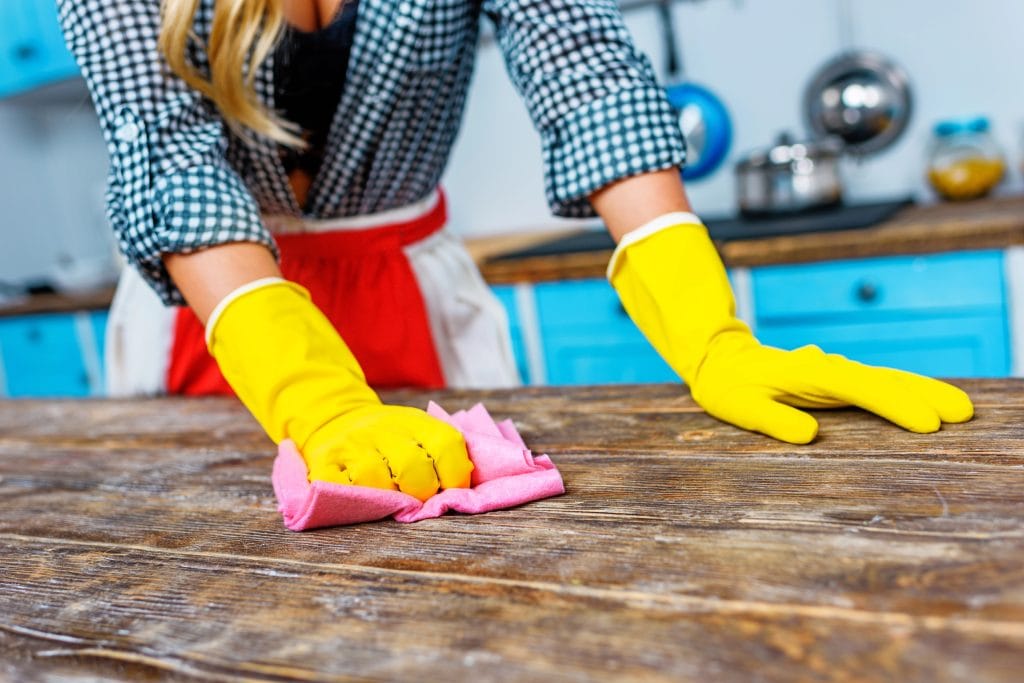 cleaning the kitchen counter before moving out