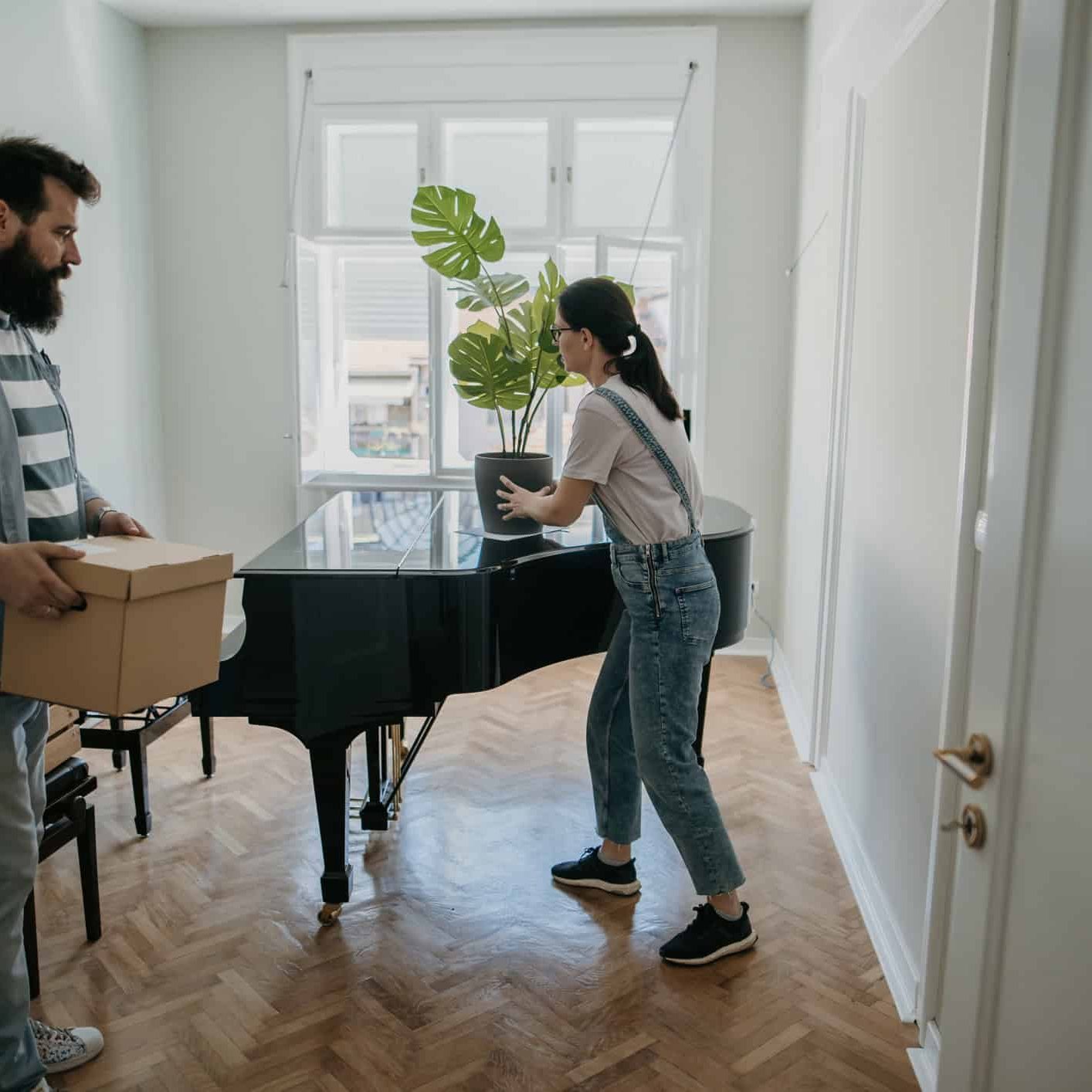couple moving a piano